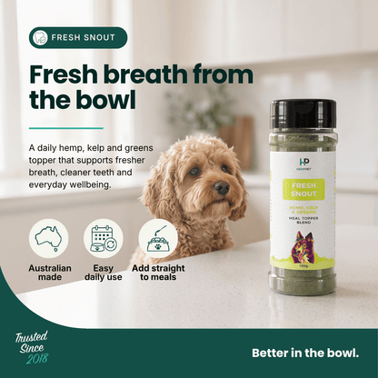 A bottle of HP Fresh Snout herbal powder stands on a kitchen counter next to a small fluffy dog, with marketing text and icons about Australian made, easy daily use, and add straight to meals.